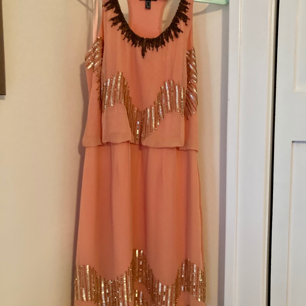 Stunning coral dress with intricate beading!